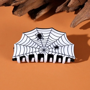 Halloween spider web hair claw clip with black pattern on white background for women