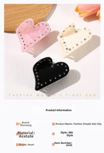 Macro detail of acetate heart hair claws with rhinestones in pink, beige and black