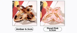 Détail des pinces à cheveux trèfle de 6,5 cm en ambre et rose floral avec touches d'or