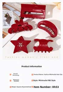 Close-up of red acetate hair claws in star and geometric shapes with rhinestone accents
