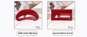 Detail view of red acetate hair claws with dimensions 9cm and 10.3cm for festive hair styling