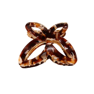 Pince à cheveux nœud doré avec motif écaille de tortue pour demi-queue de cheval