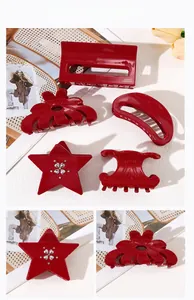 Detail view of red acetate hair clips with star shapes and rhinestones for women