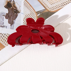 Elegant red flower hair claw clip with glossy finish and gold logo for women
