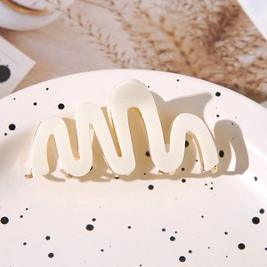 Elegant cream white wavy acetate hair claw clip with golden metal teeth for women
