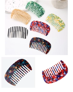 Close-up of elegant acetate hair combs with various marble and stone texture patterns