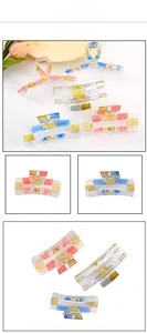 Detail view of retro checkerboard pattern acrylic hair claws in multiple color combinations