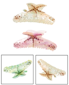 Macro detail of oversized starfish hair claws with sparkling rhinestones in four colors