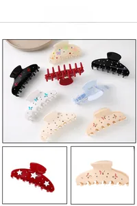 Detail of Korean style hair claws with rhinestones and colorful butterfly patterns