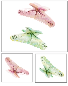 Detail view of large acetate starfish hair claws with colorful marble texture and rhinestones