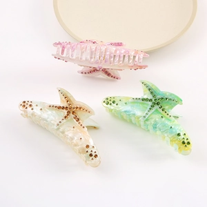 Set of three colorful starfish hair claws with sparkling rhinestones in summer marble style