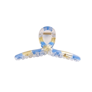 Transparent rectangular hair claw clip with blue and yellow patterns in a modern style