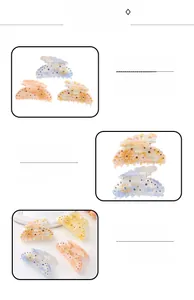 Detailed view of acetate celestial hair claw clips with sun patterns and rhinestones