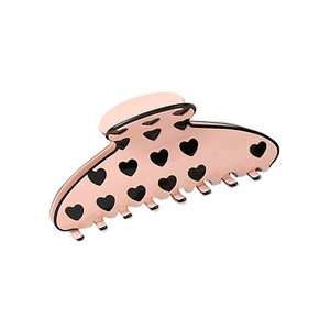 Pince à cheveux rose avec motif de cœur et design incurvé en demi-lune pour coiffure