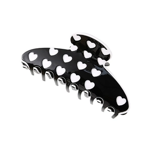 Grande pince à cheveux noire minimaliste avec motifs cœurs blancs et finition en résine