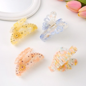 Elegant acetate butterfly hair claws with rhinestones in four soft pastel colors