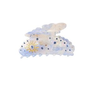 Elegant light blue cloud hair claw clip with golden sun and sparkling rhinestones