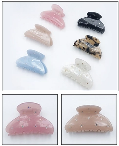 Set of six colorful acetate hair claws with sparkling star-shaped rhinestone accents