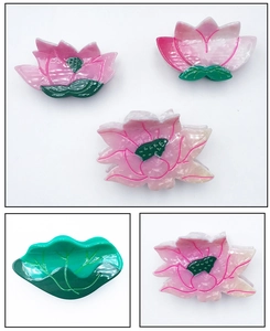 Macro detail of acetate lotus and leaf hair claws with elegant marble textures