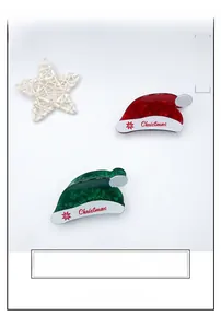 Detail of Christmas hat claw clip set with marble texture and festive lettering
