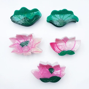 Elegant lotus flower and leaf acetate hair claws set in pink and green colors
