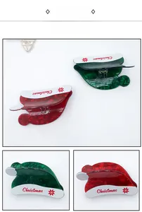 Detail shots of red and green Christmas hat hair claws showing different angles and print