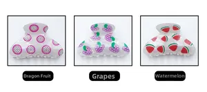 Detailed views of fruit-themed hair claws in dragon fruit, grape, and watermelon patterns