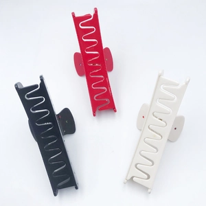 Acetate arched claw clips with colorful rhinestones in black, red, and cream white colors