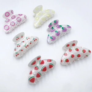 Set of 6 colorful PVC fruit hair claws featuring strawberry, watermelon and lemon designs
