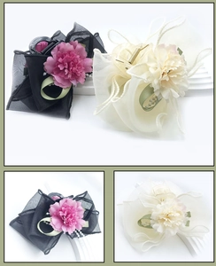 Detailed macro view of mesh peony flower hair claws with pearl and ribbon accents