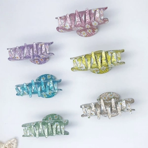 Set of six colorful glitter daisy hair claws in pink purple and blue acrylic