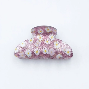 Pink glitter acrylic hair claw clip with white daisy print floral design for women