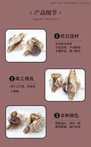 Detail view of 3D fabric rose hair claw clip made of resin in various earthy colors