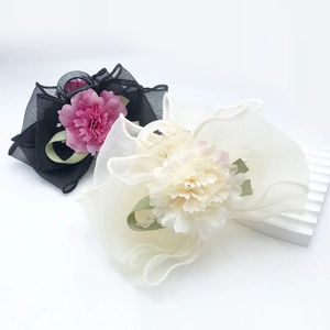 Elegant floral mesh bow hair claws in black and cream with delicate pearls for women