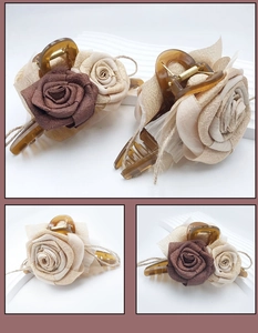 Detail of elegant 3D resin rose hair claw clip with vintage fabric and amber acrylic texture