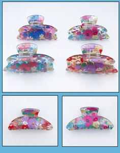 Detailed macro view of PVC floral hair claws with colorful prints and metal spring mechanism