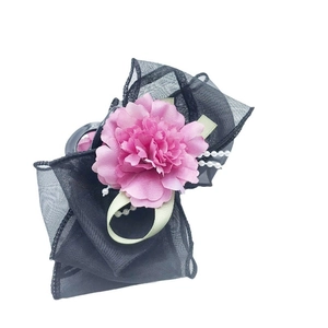 Elegant pink mesh flower hair claw clip with pearl accents and black tulle bow design