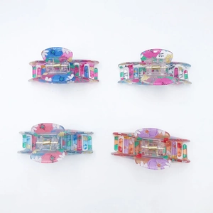 Set of four floral PVC hair claws with colorful prints and durable metal springs