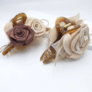 Elegant 3D resin rose hair claw clips in vintage amber with handmade fabric flowers