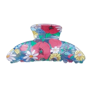 Floral print hair claw clip featuring red poppies and daisies with a blue gradient base