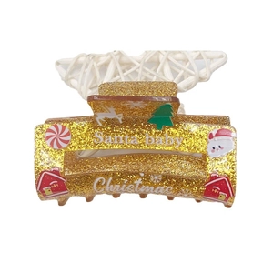 Golden glitter acrylic Christmas hair claw with Santa Baby text and holiday icons