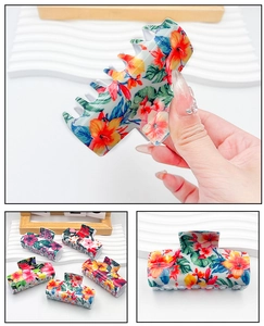 Detail showing hibiscus floral prints on large acrylic hair claw clip for thick hair