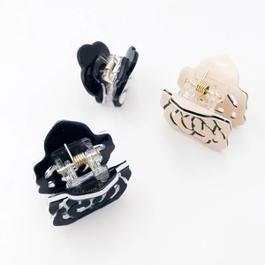 Elegant hollow rose hair claw clip set with acrylic floral design and gold spring