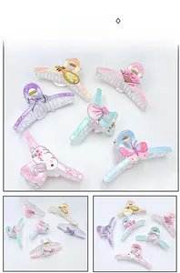 Detailed views of acrylic hair claws with traditional Chinese motifs like fans and lutes