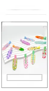 Detailed flat lay of colorful acrylic fruit and checkered hair clips on display stand