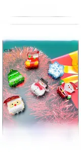 Set of 6 Christmas hair clips with glitter finish featuring snowman and tree shapes