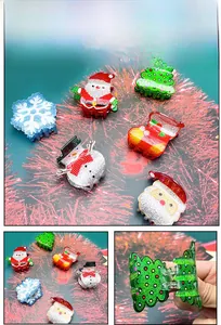 Detail of glittery Christmas hair claws showing festive snowman and tree designs