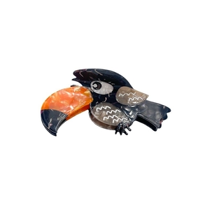 Exquisite toucan bird acetate hair claw clip with colorful marble textures and sleek finish