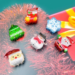 Glittery Christmas hair claw clips set featuring snowman, tree and snowflake patterns