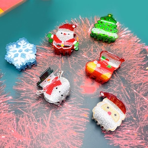 Glittery Christmas hair claw clips set featuring snowman, snowflake and Santa designs